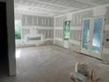 Spacious living room with large windows, under construction at 1787 Pennington Se Pl, Atlanta, GA 30316