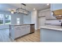 Modern kitchen with gray cabinets, island and granite countertops at 6214 Ripple Way # 91, South Fulton, GA 30349