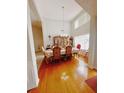 Formal dining room with hardwood floors and a large table at 2290 Taylor Pointe Way, Dacula, GA 30019