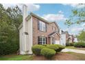 Brick two-story house with landscaping and a driveway at 4029 Riverside Pkwy, Decatur, GA 30034