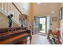 Bright entryway with tile floors and staircase at 7110 Smithers Sw Way, South Fulton, GA 30331