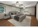 Main bedroom with hardwood floors and barn door at 5720 Deerfield Trl, Atlanta, GA 30349