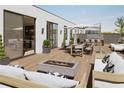 Spacious rooftop deck with lounge seating, dining area, and fire pit at 318 Sandy Springs Cir # 360, Sandy Springs, GA 30328