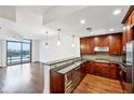 Modern kitchen with dark wood cabinets and granite counters at 270 17Th Nw St # 1708, Atlanta, GA 30363