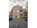 Tan 3-story building with balconies and parking at 238 Walker Sw St # 32, Atlanta, GA 30313