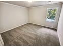 Bright bedroom with neutral walls and plush carpeting at 709 Tribal Trl, Woodstock, GA 30188