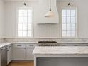 Modern kitchen featuring marble countertops and stainless steel appliances at 2701 Southwell St, Atlanta, GA 30305