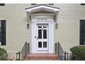 Classic front door entry with elegant detailing and brick steps at 434 Brentwood Ne Dr, Atlanta, GA 30305