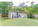 Tan brick ranch house with gray steps and landscaping at 1278 Lynwyn Se Ln, Atlanta, GA 30316