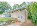 Side view of tan brick ranch house with landscaping at 1278 Lynwyn Se Ln, Atlanta, GA 30316