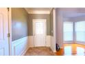 Bright entryway with tile flooring and wainscoting at 2455 Kirkstone Dr, Buford, GA 30519