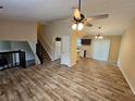 Spacious living room with vaulted ceilings, hardwood floors, and kitchen view at 1378 Mill Lake Cir, Stone Mountain, GA 30088