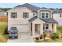 Two story home with brick facade and landscaping at 719 Sara Meadow Rd, Loganville, GA 30052
