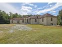 Brick house exterior with landscaping, large lawn, and mature trees at 2000 Enon Sw Rd, Atlanta, GA 30331