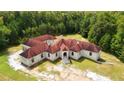 Luxury home with red roof and large yard at 2000 Enon Sw Rd, Atlanta, GA 30331