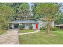 Ranch style home with red door and carport at 3189 Dogwood Dr, Atlanta, GA 30344