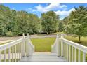 White railing stairs leading to a home with a view of the street at 4050 Harvest Ridge Dr, Douglasville, GA 30135