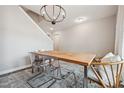 Dining area with a wood table and modern chandelier at 415 Splash Pointe, Temple, GA 30179