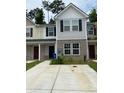 Modern two-story townhome with a welcoming front porch at 2546 Piering Dr, Lithonia, GA 30038