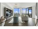 Modern living room with city views and hardwood floors at 788 West Marietta St # 1604, Atlanta, GA 30318