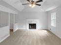 Living room with fireplace and neutral carpet at 145 Dunwick Ln, Mcdonough, GA 30253