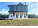 Two-story home with gray siding and white accents at 6000 Stallion Rdg, Douglasville, GA 30135