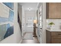 Bright hallway with hardwood floors and neutral walls at 803 Dundee Way, Cartersville, GA 30121