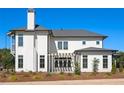 Rear view of a two-story house, highlighting a pergola and patio at 6001 Stallion Rdg, Douglasville, GA 30135