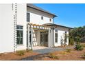 Side view of the home showcasing a patio and pergola at 6001 Stallion Rdg, Douglasville, GA 30135