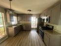 Updated kitchen with stainless steel appliances and granite countertops at 435 Ridgedale Way, Lawrenceville, GA 30044