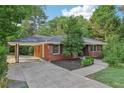 Front view of brick ranch house with carport and landscaping at 2347 Lavista Ne Rd, Atlanta, GA 30329