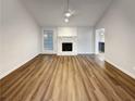 Living area with fireplace and wood-look flooring at 3624 Nessa Se Ct, Smyrna, GA 30082