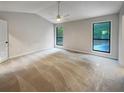 Spacious main bedroom with high ceilings and carpet at 3624 Nessa Se Ct, Smyrna, GA 30082