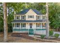 Charming two-story home with wraparound porch at 1486 Willow Bnd, Woodstock, GA 30188