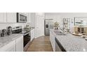 Modern kitchen featuring stainless steel appliances and granite countertops at 134 Oakchase Park Ln, Hampton, GA 30228