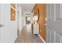 Bright entryway with wood-look floors and an accent wall at 134 Oakchase Park Ln, Hampton, GA 30228