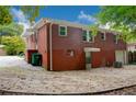 Brick Ranch home with a large backyard, patio, and landscaping at 690 Green Acres Se Rd, Smyrna, GA 30080
