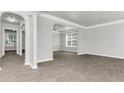 Spacious living room with grey wood-look floors at 2146 Silva Ct, Conley, GA 30288