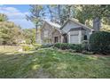 House exterior showcasing stone accents and manicured landscaping at 6280 Wiscasset Nw Pkwy, Dallas, GA 30157