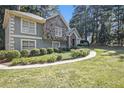 House exterior showcasing stone accents and manicured landscaping at 6280 Wiscasset Nw Pkwy, Dallas, GA 30157
