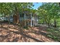 Side view of two-story house with porch and stone accents at 294 Puckett Se Rd, Emerson, GA 30137