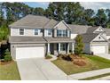 Two story home with gray siding and brick accents at 6019 Wheeler Ridge Rd, Auburn, GA 30011