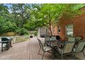 Spacious deck with seating area, overlooks a lush backyard and includes a grill at 1323 Briarcliff Ne Rd, Atlanta, GA 30306