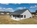 Single-story home with screened porch and backyard at 3749 Tielman St, Snellville, GA 30078