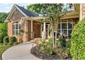 Inviting front porch with landscaping and walkway at 1845 Chloe Ct, Lawrenceville, GA 30043