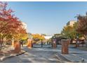 Gated entrance to community with landscaping and brick pillars at 898 Oak Sw St # 3108, Atlanta, GA 30310