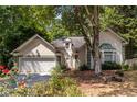 Charming two-story home with a two-car garage and mature trees at 652 Trailwood Sw Ln, Marietta, GA 30064