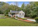House exterior showcasing a two-car garage and spacious yard at 178 Seals Dr, Dallas, GA 30157