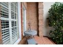 Small brick patio with wrought iron table and chairs, next to the home at 3021 Margaret Mitchell Dr # 8, Atlanta, GA 30327