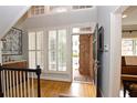 Spacious entryway with hardwood floors, built in shelving, and lots of natural light at 3021 Margaret Mitchell Dr # 8, Atlanta, GA 30327